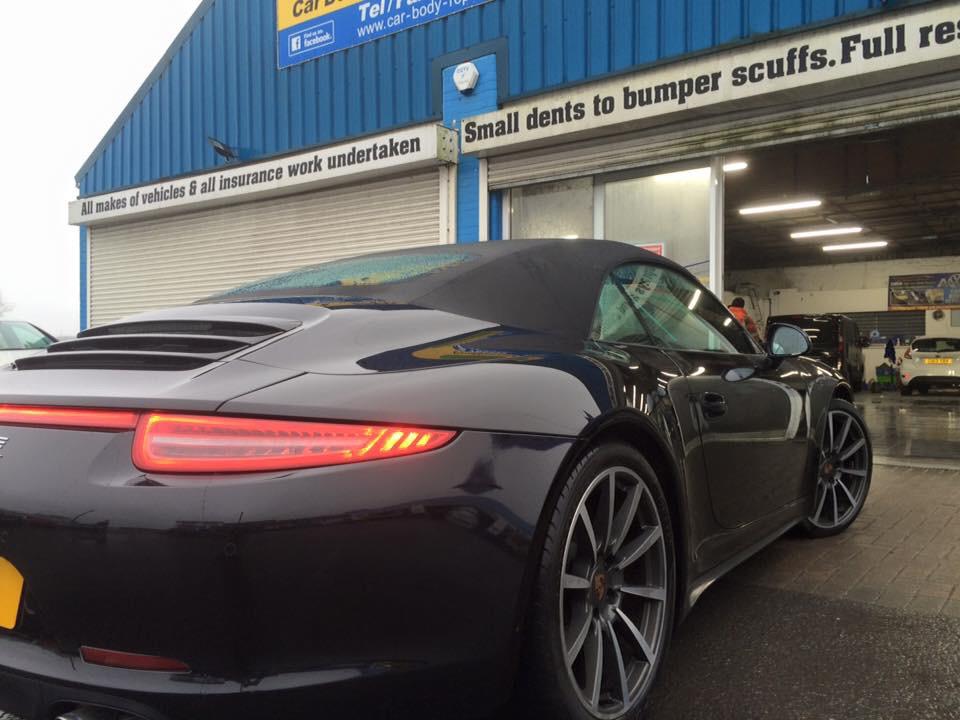 Black Porsche rear view car spraying car body repairs Swansea