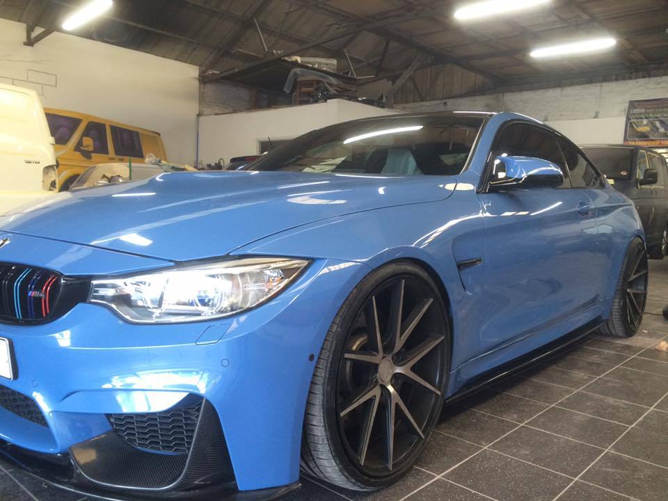 Blue BMW respray bumper and passenger door dent repairs Swansea