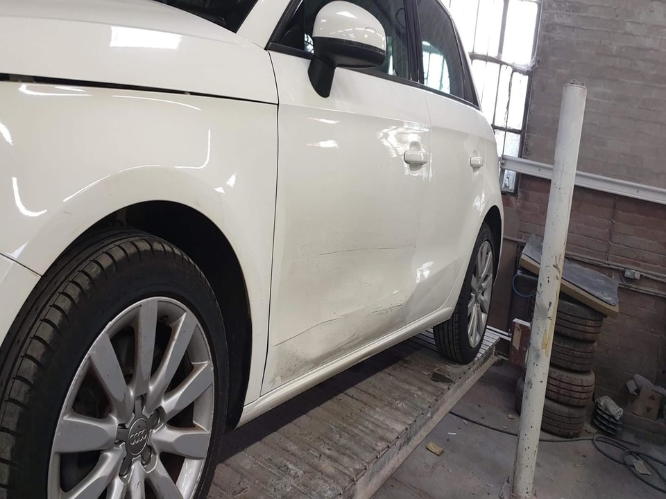 Damaged passenger door white Audi Car Spraying Swansea
