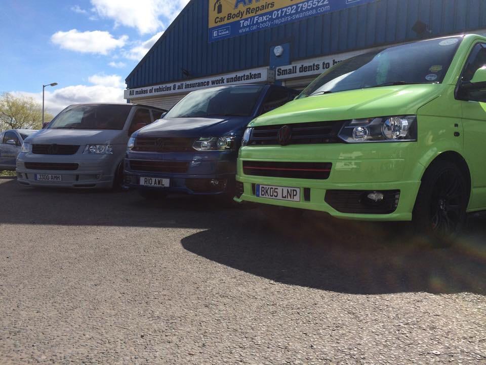 Row of VW Transporter Vans Newly Resprayed with Body Kits at AWL Car Body Repairs Swansea