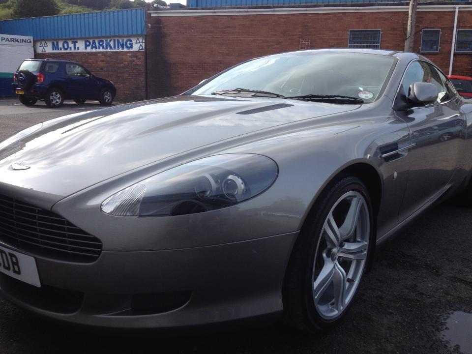Silver Aston Martin after body work repairs and paintwork at AWL Car Body Repairs Swansea