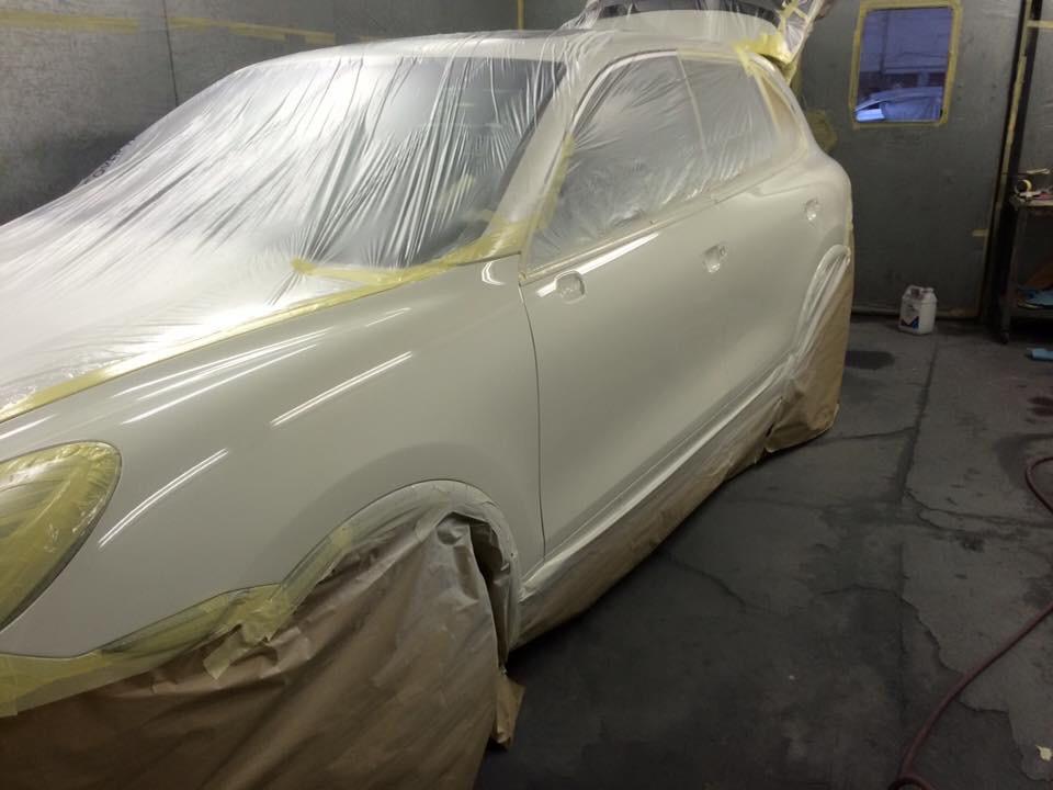 White Porsche Cayenne finished paint work in Oven at AWL Car Body Repairs Swansea