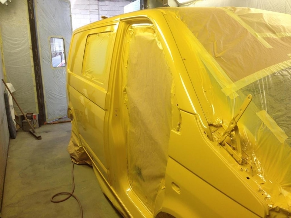 White VW Transporter Van having Total Yellow Respray in oven at AWL Swansea
