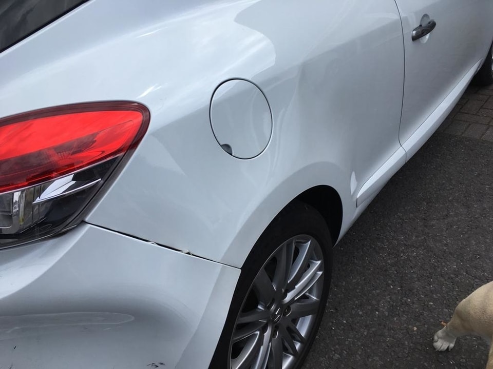 bumper damage white Renault Megane Dent Repair Swansea